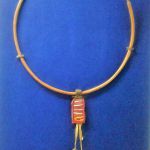 Necklace worn by a young Pokot girl, Wood, leather, stone, metal and beads © Collection of Kitale Museum, Kenya
