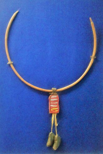 Necklace worn by a young Pokot girl, Wood, leather, stone, metal and beads © Collection of Kitale Museum, Kenya